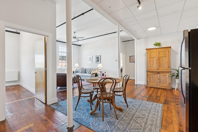 2 Main St Unit 17-410, Biddeford, ME 04005 - dining space with radiator, dark wood-type flooring, a ceiling fan, and baseboards