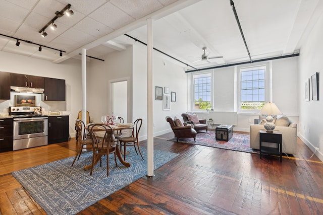 2 Main St Unit 17-410, Biddeford, ME 04005 - dining area with hardwood / wood-style flooring, rail lighting, ceiling fan, and baseboards