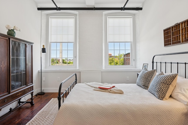 2 Main St Unit 17-410, Biddeford, ME 04005 - bedroom featuring dark wood finished floors, radiator, and baseboards