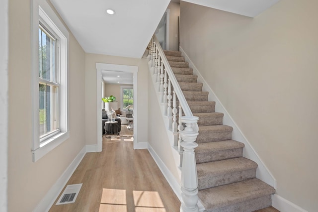 558 High St, West Gardiner, ME 04345 - staircase featuring wood finished floors, baseboards, and recessed lighting