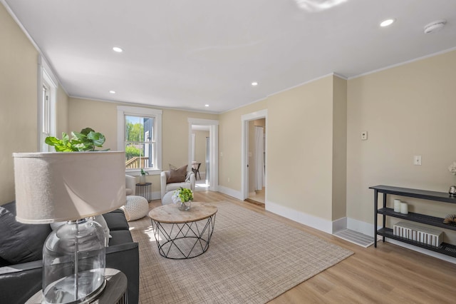 558 High St, West Gardiner, ME 04345 - living room featuring light wood finished floors, crown molding, baseboards, and recessed lighting