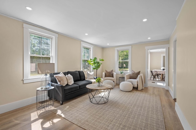 558 High St, West Gardiner, ME 04345 - living area with ornamental molding, wood finished floors, recessed lighting, and baseboards