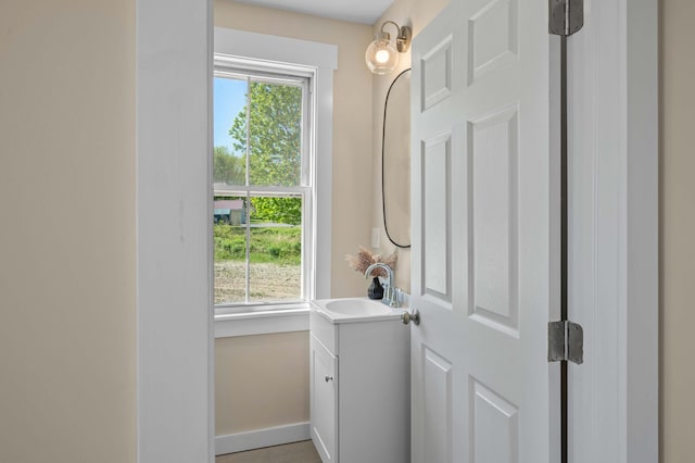 558 High St, West Gardiner, ME 04345 - bathroom featuring vanity, plenty of natural light, and baseboards