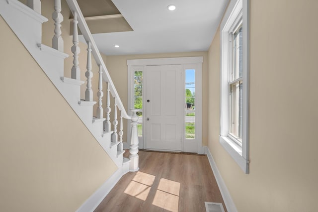 558 High St, West Gardiner, ME 04345 - entryway with baseboards, wood finished floors, recessed lighting, and stairs