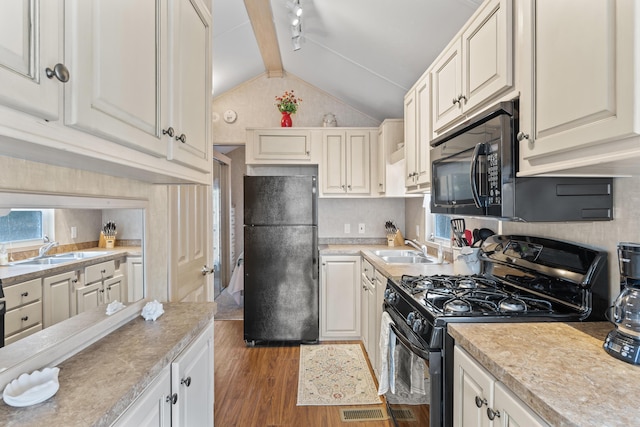 430 Post Rd Unit 139, Wells, ME 04090 - kitchen with black appliances, a sink, wood finished floors, and light countertops