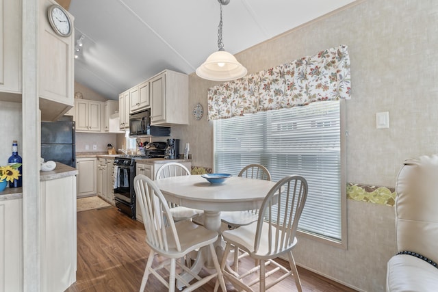 430 Post Rd Unit 139, Wells, ME 04090 - dining space featuring vaulted ceiling, wood finished floors, wallpapered walls, and healthy amount of natural light