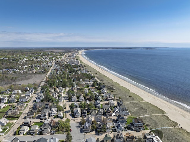 aerial overview of property's location with unending shoreline and nearby suburban area