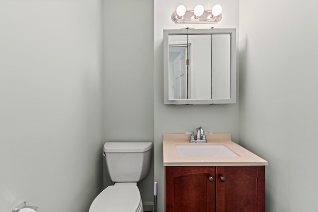 half bath with vanity and toilet