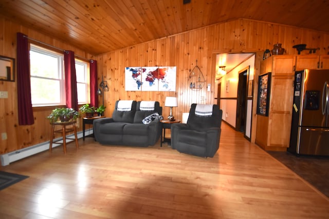 living room with vaulted ceiling, wooden walls, a baseboard radiator, wood finished floors, and wooden ceiling