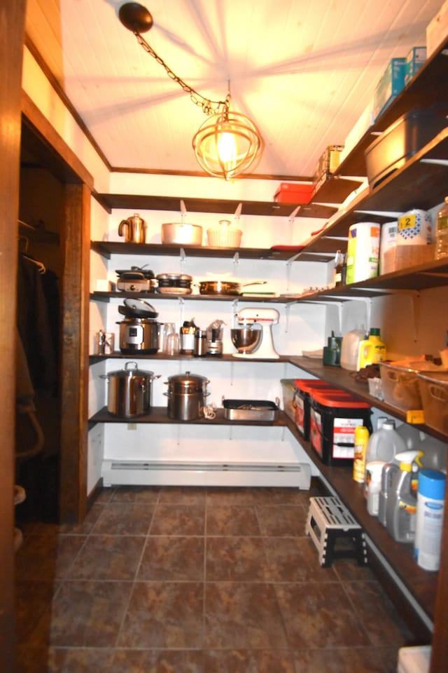 pantry featuring a baseboard heating unit