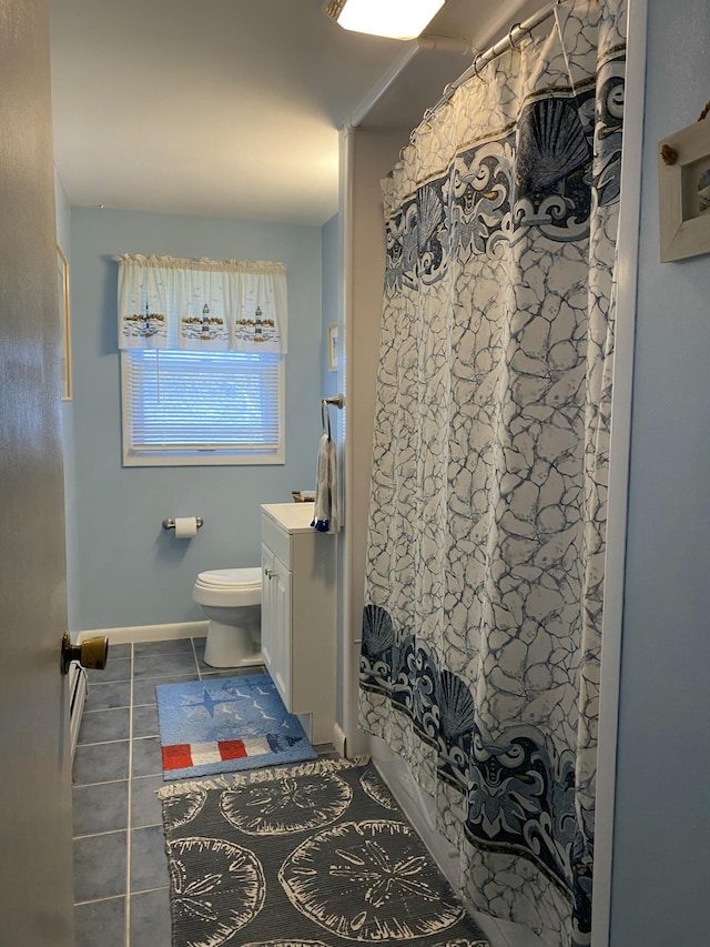 17 Canterbury Rd, Brewer, ME 04412 - full bathroom featuring tile patterned floors, toilet, vanity, a baseboard radiator, and baseboards