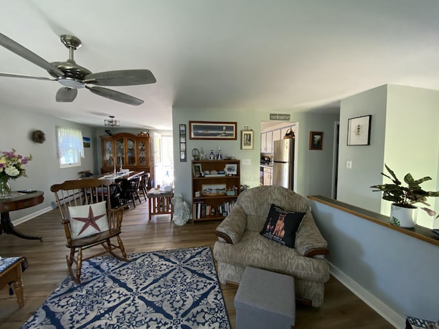 17 Canterbury Rd, Brewer, ME 04412 - living area featuring plenty of natural light, ceiling fan, wood finished floors, and baseboards