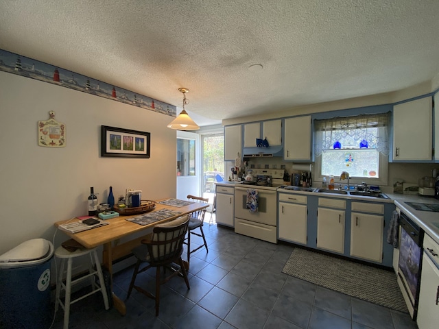 17 Canterbury Rd, Brewer, ME 04412 - kitchen with electric stove, a sink, a textured ceiling, dark tile patterned floors, and decorative light fixtures
