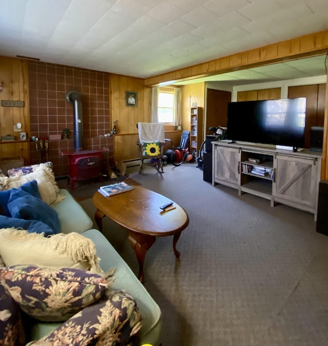 17 Canterbury Rd, Brewer, ME 04412 - carpeted living area with a wood stove and wooden walls