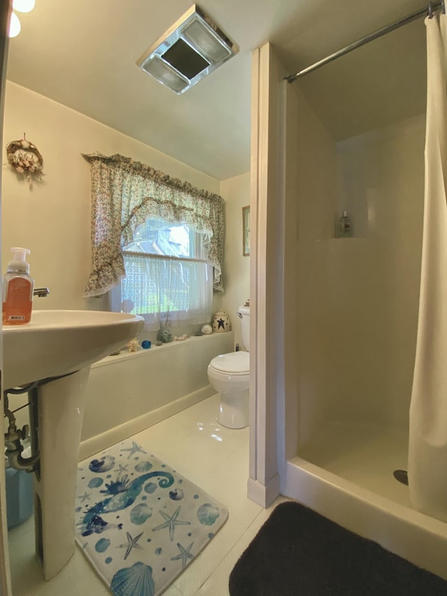 17 Canterbury Rd, Brewer, ME 04412 - full bath with a stall shower, tile patterned flooring, and toilet