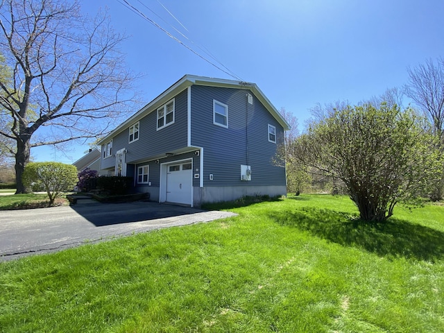17 Canterbury Rd, Brewer, ME 04412 - view of home's exterior with an attached garage, driveway, and a yard