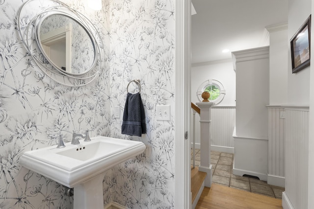 9 Edes Rd, Cumberland, ME 04021 - bathroom featuring wainscoting, ornamental molding, and wood finished floors