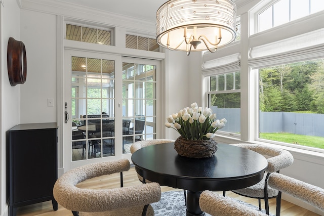 9 Edes Rd, Cumberland, ME 04021 - dining space featuring ornamental molding, a chandelier, and wood finished floors