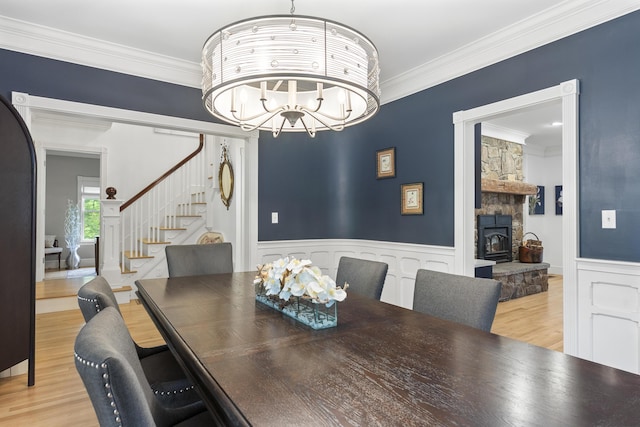 9 Edes Rd, Cumberland, ME 04021 - dining area with stairway, wood finished floors, crown molding, wainscoting, and a chandelier