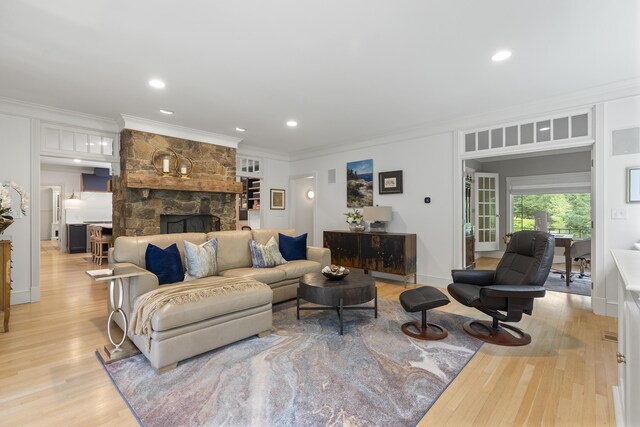 9 Edes Rd, Cumberland, ME 04021 - living room featuring ornamental molding, light wood-type flooring, a fireplace, recessed lighting, and baseboards