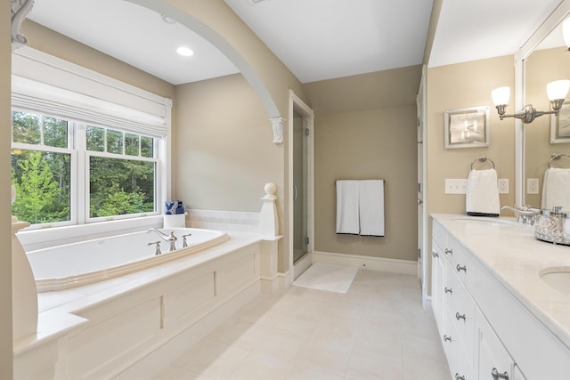 9 Edes Rd, Cumberland, ME 04021 - bathroom with a garden tub, double vanity, tile patterned flooring, and a stall shower