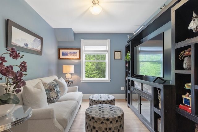 9 Edes Rd, Cumberland, ME 04021 - living area featuring healthy amount of natural light, light wood-style floors, and baseboards