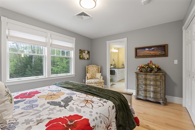 9 Edes Rd, Cumberland, ME 04021 - bedroom with light wood finished floors, a closet, ensuite bathroom, and baseboards