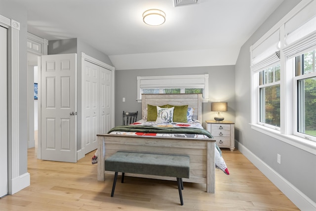 9 Edes Rd, Cumberland, ME 04021 - bedroom featuring light wood-style flooring, baseboards, vaulted ceiling, and a closet