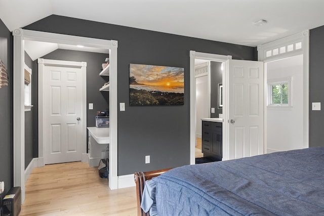 9 Edes Rd, Cumberland, ME 04021 - bedroom featuring light wood-style floors, vaulted ceiling, baseboards, and connected bathroom