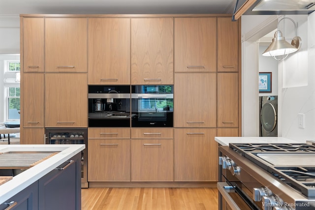 9 Edes Rd, Cumberland, ME 04021 - kitchen featuring stainless steel appliances, light wood-type flooring, light countertops, and wine cooler