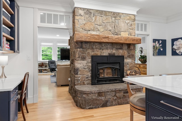 9 Edes Rd, Cumberland, ME 04021 - living area featuring ornamental molding, light wood-type flooring, and a stone fireplace
