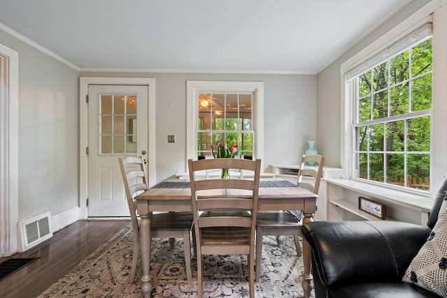 99 Spring St, Saco, ME 04072 - dining room with ornamental molding, dark wood-type flooring, plenty of natural light, and baseboards