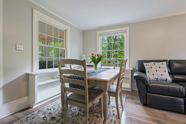 99 Spring St, Saco, ME 04072 - dining space with crown molding, wood finished floors, and baseboards