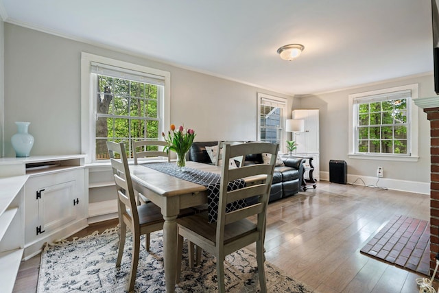 99 Spring St, Saco, ME 04072 - dining room with healthy amount of natural light, ornamental molding, and wood finished floors