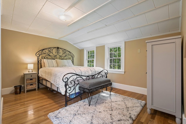 99 Spring St, Saco, ME 04072 - bedroom featuring lofted ceiling, light wood-type flooring, and baseboards