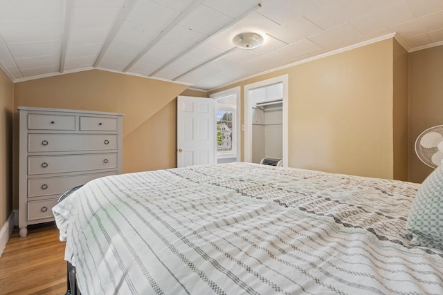 99 Spring St, Saco, ME 04072 - bedroom featuring ornamental molding, wood finished floors, lofted ceiling, and a closet