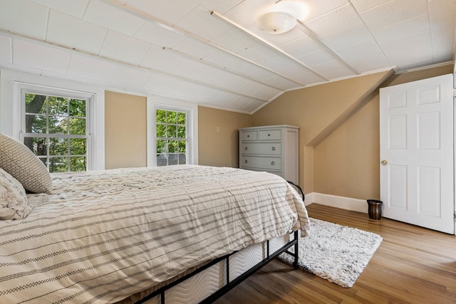 99 Spring St, Saco, ME 04072 - bedroom with wood finished floors, vaulted ceiling, and baseboards