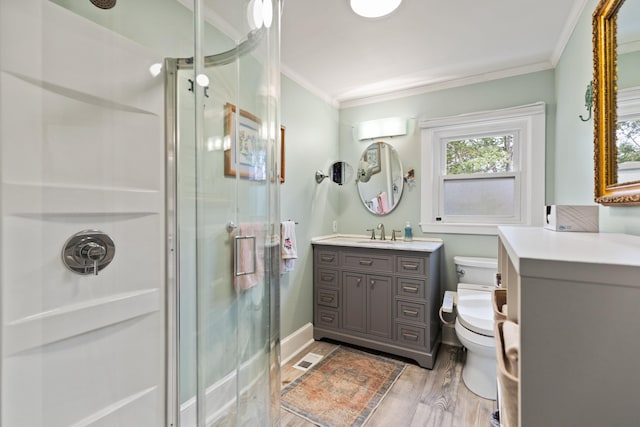 23 Amerescoggin Rd, Falmouth, ME 04105 - full bath with ornamental molding, a shower stall, vanity, toilet, and wood finished floors