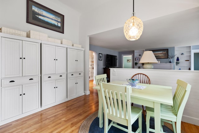 23 Amerescoggin Rd, Falmouth, ME 04105 - dining area featuring arched walkways and light wood-type flooring