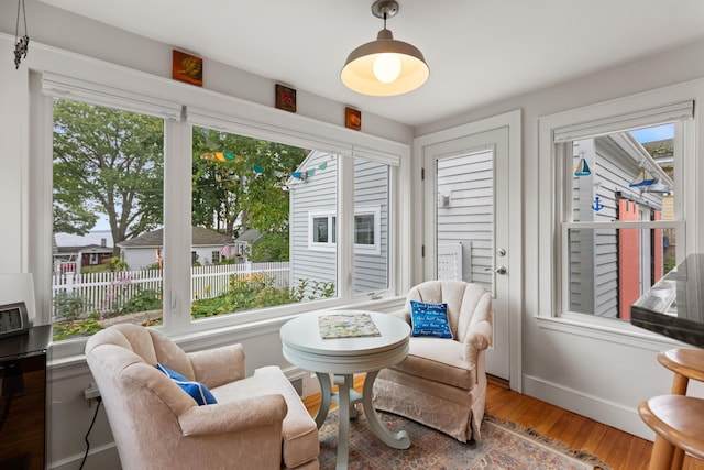 23 Amerescoggin Rd, Falmouth, ME 04105 - sitting room with wood finished floors and baseboards