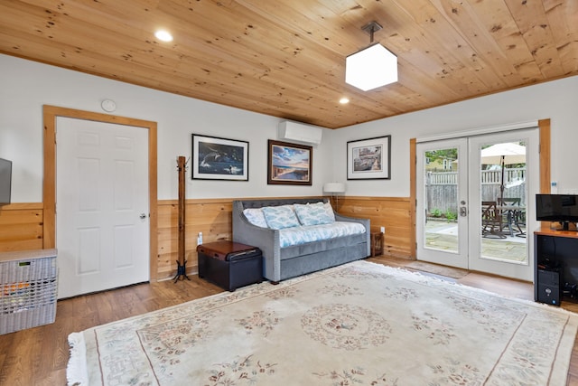 23 Amerescoggin Rd, Falmouth, ME 04105 - living area featuring wooden ceiling, french doors, a wainscoted wall, a wall mounted AC, and wood finished floors
