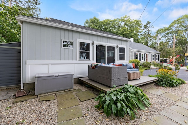 23 Amerescoggin Rd, Falmouth, ME 04105 - rear view of house featuring an outdoor hangout area, board and batten siding, and roof with shingles
