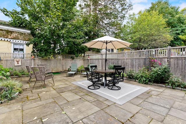 23 Amerescoggin Rd, Falmouth, ME 04105 - view of patio / terrace featuring outdoor dining area and a fenced backyard