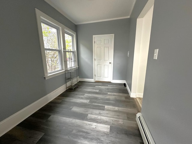 507 Waldo St, Rumford, ME 04276 - empty room featuring baseboards, a baseboard heating unit, and wood finished floors