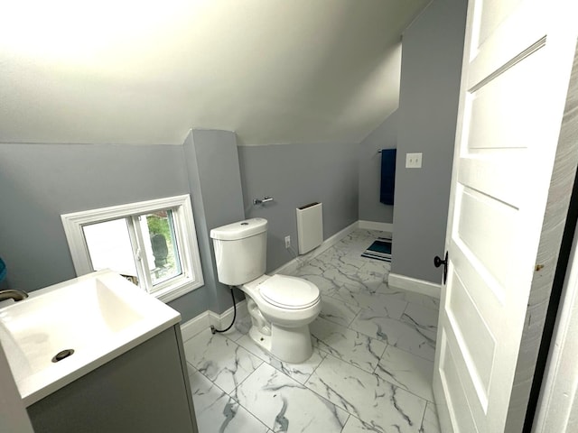 507 Waldo St, Rumford, ME 04276 - half bathroom with baseboards, marble finish flooring, toilet, vanity, and vaulted ceiling