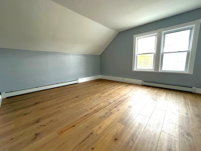 507 Waldo St, Rumford, ME 04276 - bonus room with a baseboard radiator, vaulted ceiling, hardwood / wood-style flooring, and baseboards