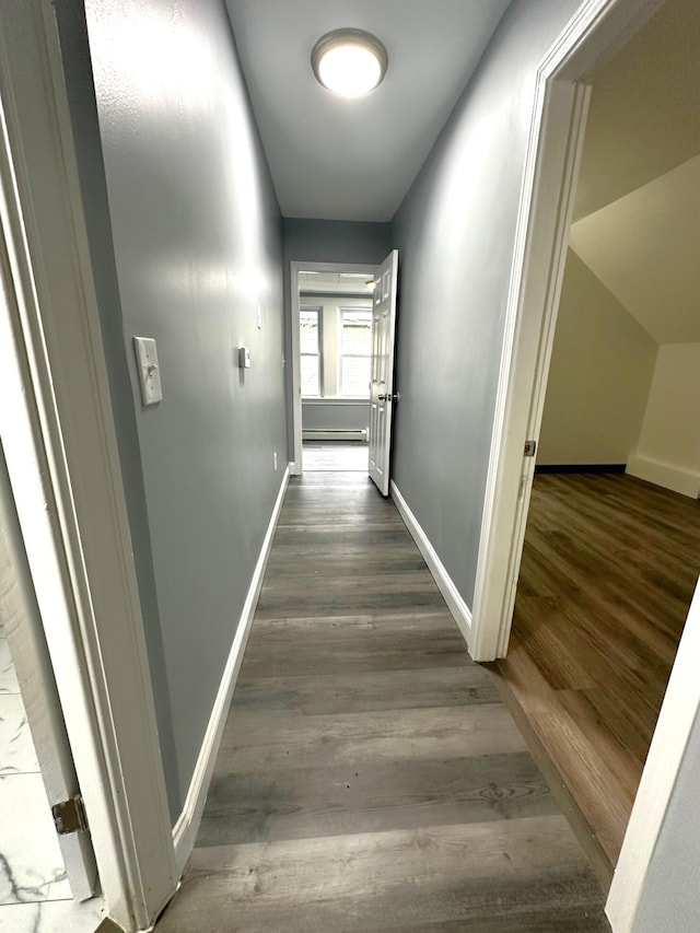 507 Waldo St, Rumford, ME 04276 - corridor featuring baseboards, wood finished floors, and a baseboard radiator