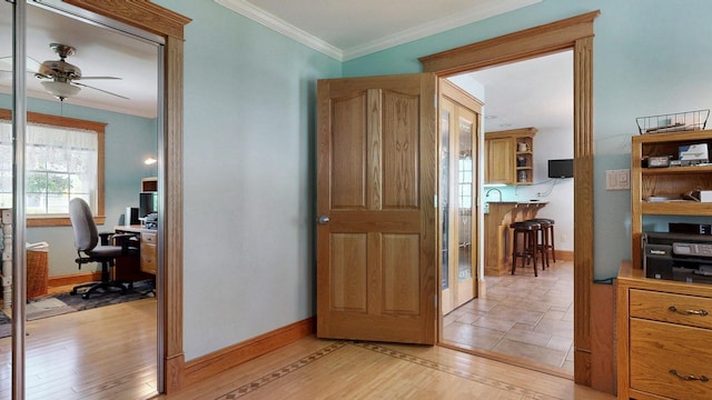 101 Parrott St, South Portland, ME 04106 - hall featuring a desk, crown molding, baseboards, and light wood-type flooring