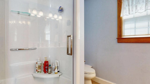 101 Parrott St, South Portland, ME 04106 - full bathroom with a stall shower, toilet, and baseboards