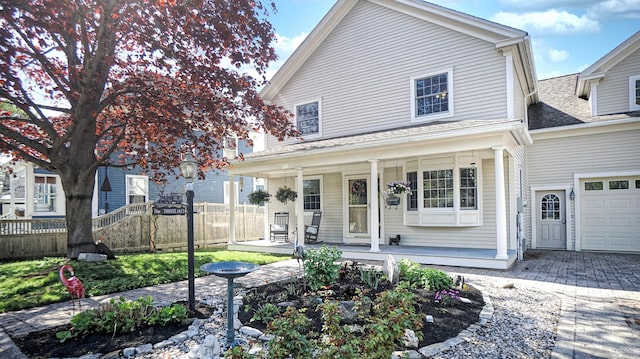 101 Parrott St, South Portland, ME 04106 - view of front of home with a porch, fence, driveway, and roof with shingles